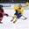 ZUG, SWITZERLAND - APRIL 23: Sweden's Sebastian Ohlsson #21 chases down a loose puck while Canada's Ethan Bear #2 attempts to slow him down during quarterfinal round action at the 2015 IIHF Ice Hockey U18 World Championship. (Photo by Francois Laplante/HHOF-IIHF Images)
